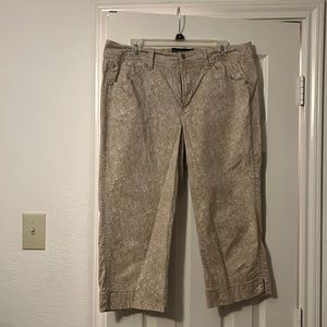 Summer fun capris. Size 14. Tan and white flower design. Legs are mid shin